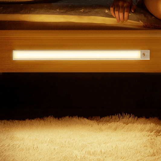 Smart LED motion sensor light with magnetic base, perfect for wardrobes, furniture, and showcases. USB rechargeable.