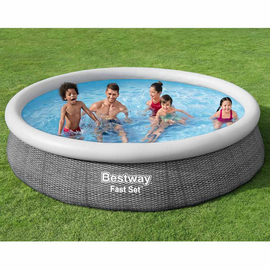 Bestway 366×76 cm round DuraPlus™ above-ground pool with rattan print walls and Flowclear™ filter pump in garden setting.