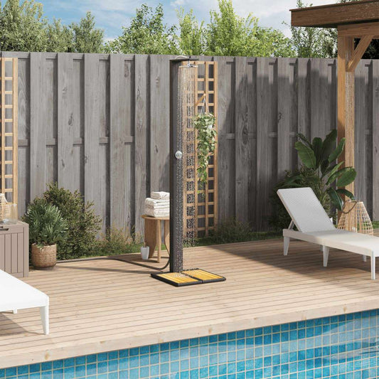 Outdoor garden shower in grey PE-rattan with acacia wood floor and rotating shower head.