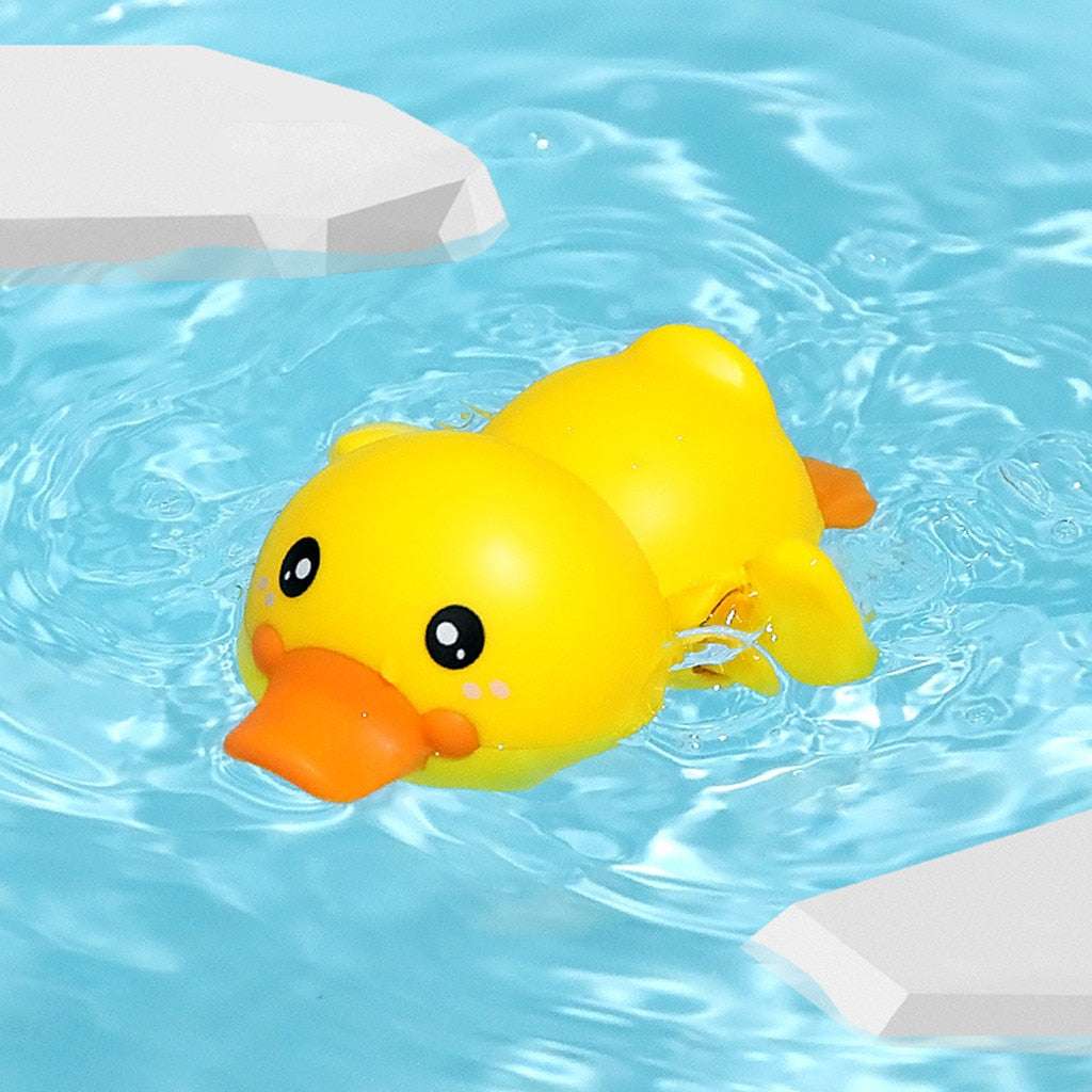 Cute yellow duck bath toy with clockwork mechanism for swimming and walking, perfect for bath time fun.