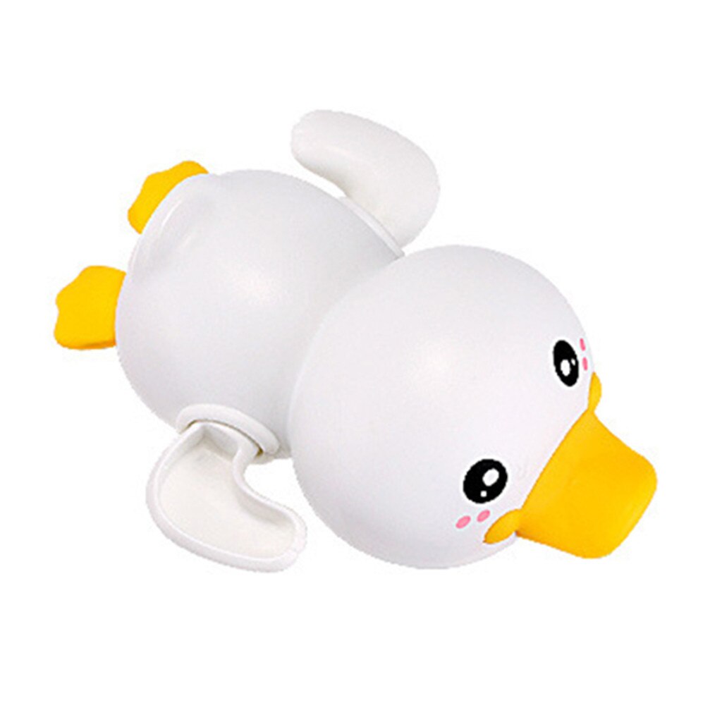 Cute white duck bath toy with clockwork mechanism for swimming and walking, perfect for bath time fun.