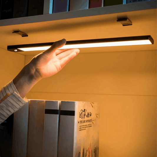 Smart LED motion sensor light with magnetic base, perfect for wardrobes, furniture, and showcases. USB rechargeable.