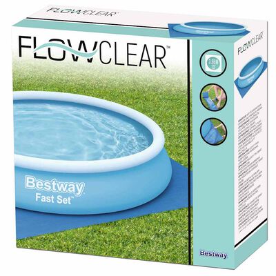 Blue Bestway Flowclear protective pool underlayment 396×396 cm laid on grass beneath an above-ground pool.