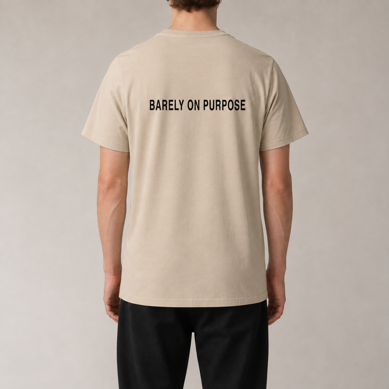 BARELY ON PURPOSE Desert Dust organic statement T-shirt — realistic rear view on model