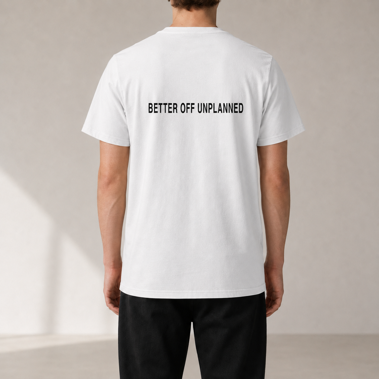 BETTER OFF UNPLANNED White organic statement T-shirt — realistic rear view on model