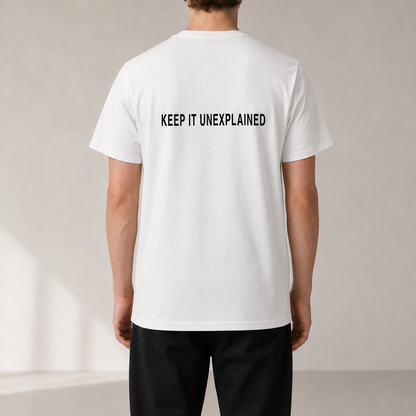 KEEP IT UNEXPLAINED White organic statement T-shirt — realistic rear view on model