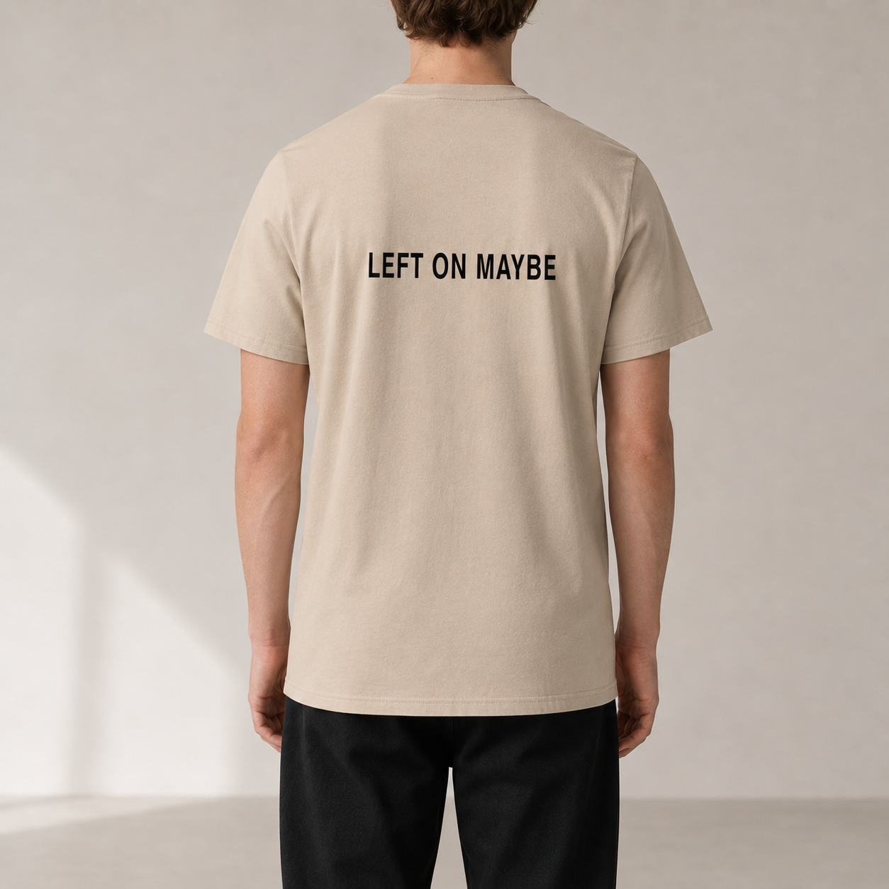 LEFT ON MAYBE Desert Dust organic statement T-shirt — realistic rear view on model